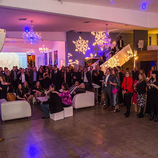 Employees Gathered in the Lounge Setup with Patterned GOBO Lighting at Ziffren Law Holiday Party in Los Angeles