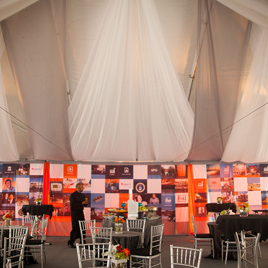Event Fabrication Photo Wall, Tenting, and Dining Tables for CSI 25th Anniversary Party in Los Angeles