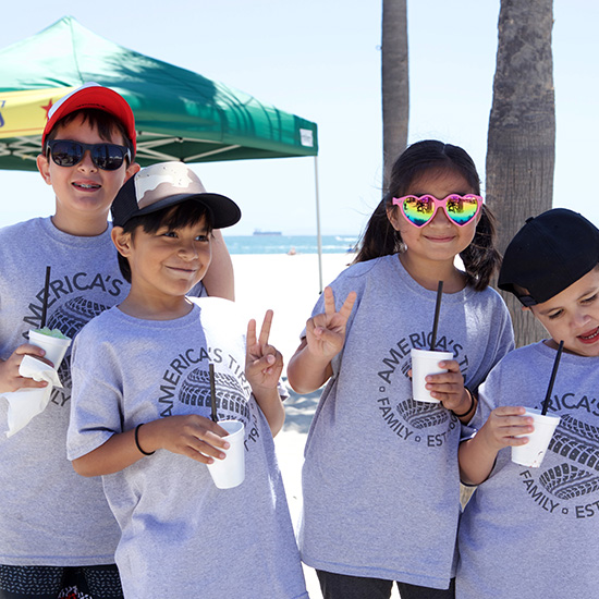 Kids Posing for Photos with Shaved Ice Picnic Fun Food at Auto Part Company Picnic in Los Angeles