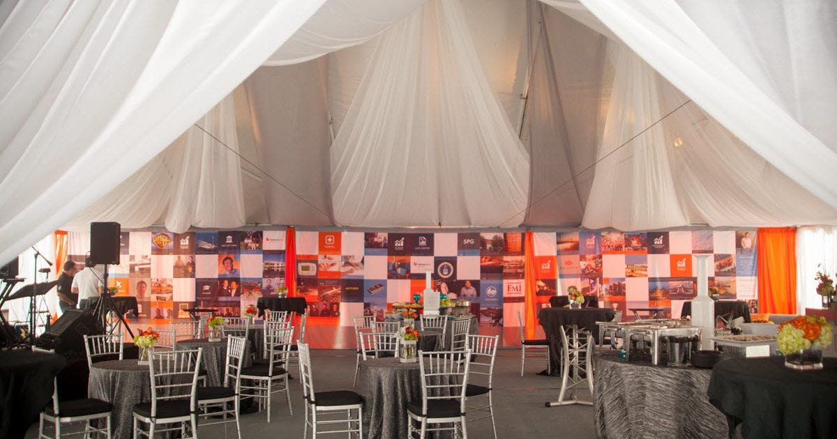 25 Anniversary Event with Tenting Floor Tables Chairs Centerpieces Stage Lights AV and Catered Buffet