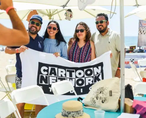 Guests Take Picture with Cartoon Network Branded Beach Towel