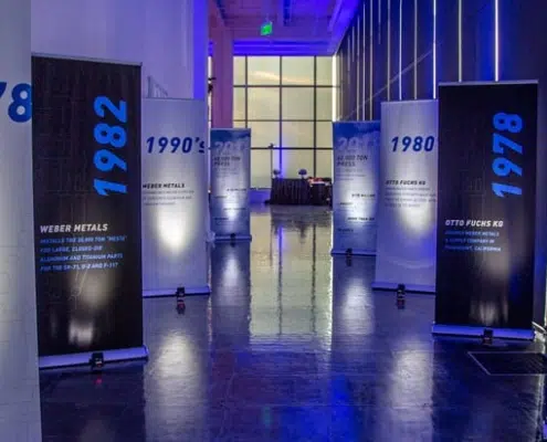 WM Walk Through Time Hall Decor with Vertical Banners for VIP Dinner Party in Los Angeles