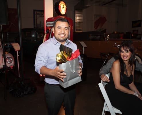 Employee with Gift Bag at Company Christmas Event
