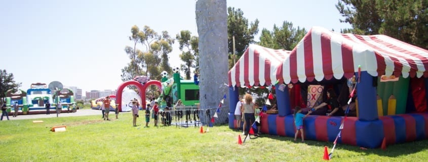 Takeda's Private Carnival Themed Picnic with Rockwall and Inflatable Carnival Game Booths Takeda's Private Carnival Themed Picnic with Rockwall and Inflatable Carnival Game Booths