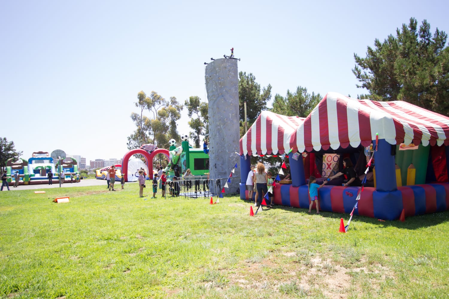Takeda's Private Carnival Themed Picnic with Rockwall and Inflatable Carnival Game Booths