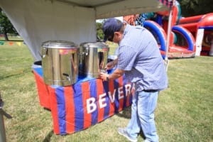 Employee Getting Beverages at Company Picnic Employee Getting Beverages at Company Picnic