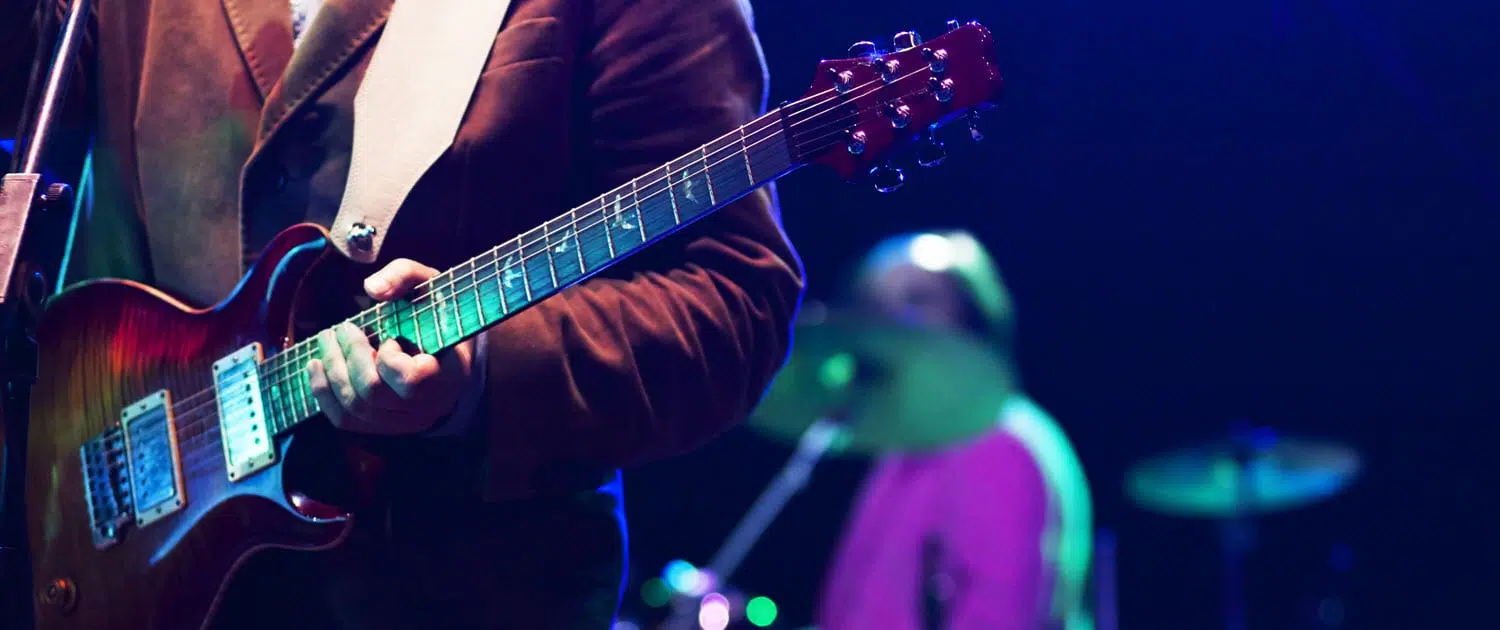 guitar live band with drums in the background on stage for party