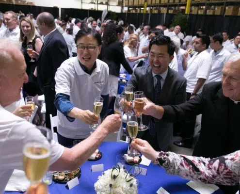 Champagne Toast at Cake Cutting Celebration Samsung-Dacor Merger