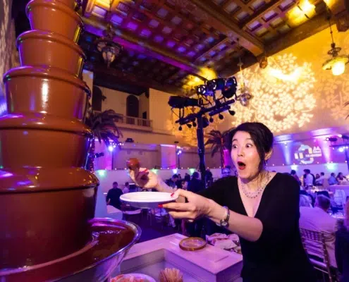 dessert action station - chocolate fountain with lighting in background for company party in San Jose, CA