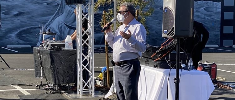 Speaker at Grand Opening wearing Mask