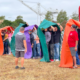 Staff Members Playing a Team Building Field Game at Dome Construction's Company Outing