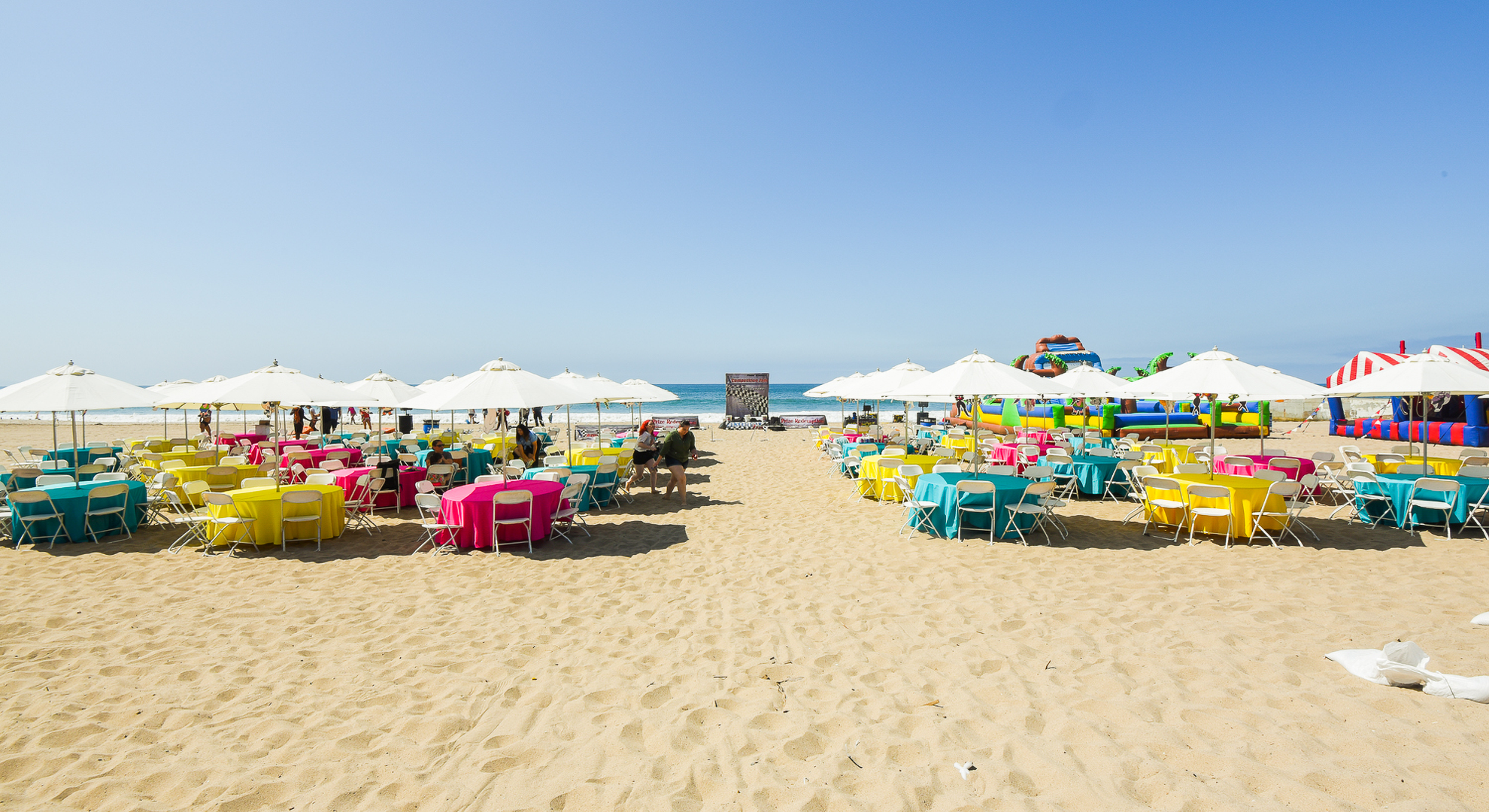 Branded Colors Used on Umbrella Tables Setup for a Beach Picnic Company Outing for Cartoon Network at Will Rogers State Beach in Pacific Palisades 10:9
