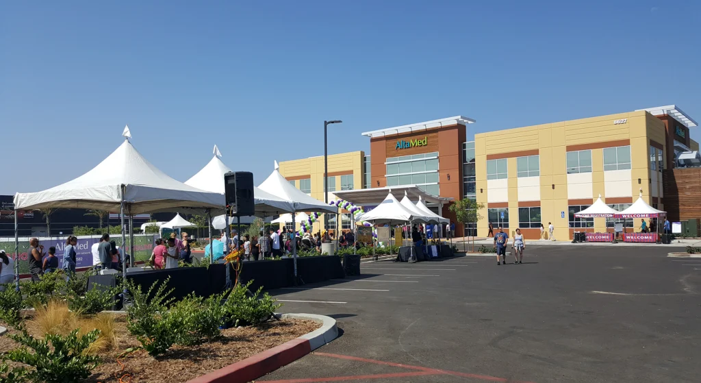 This is an outdoor event during the summer with tents and audio services.