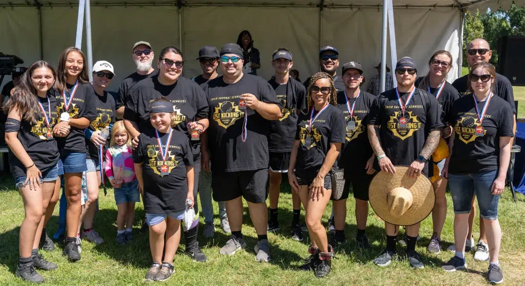 Team Posing with Medals after Team Building Kickball Tournament at San Bernardino County Employee Picnic 2025 in Glen Helen Regional Park